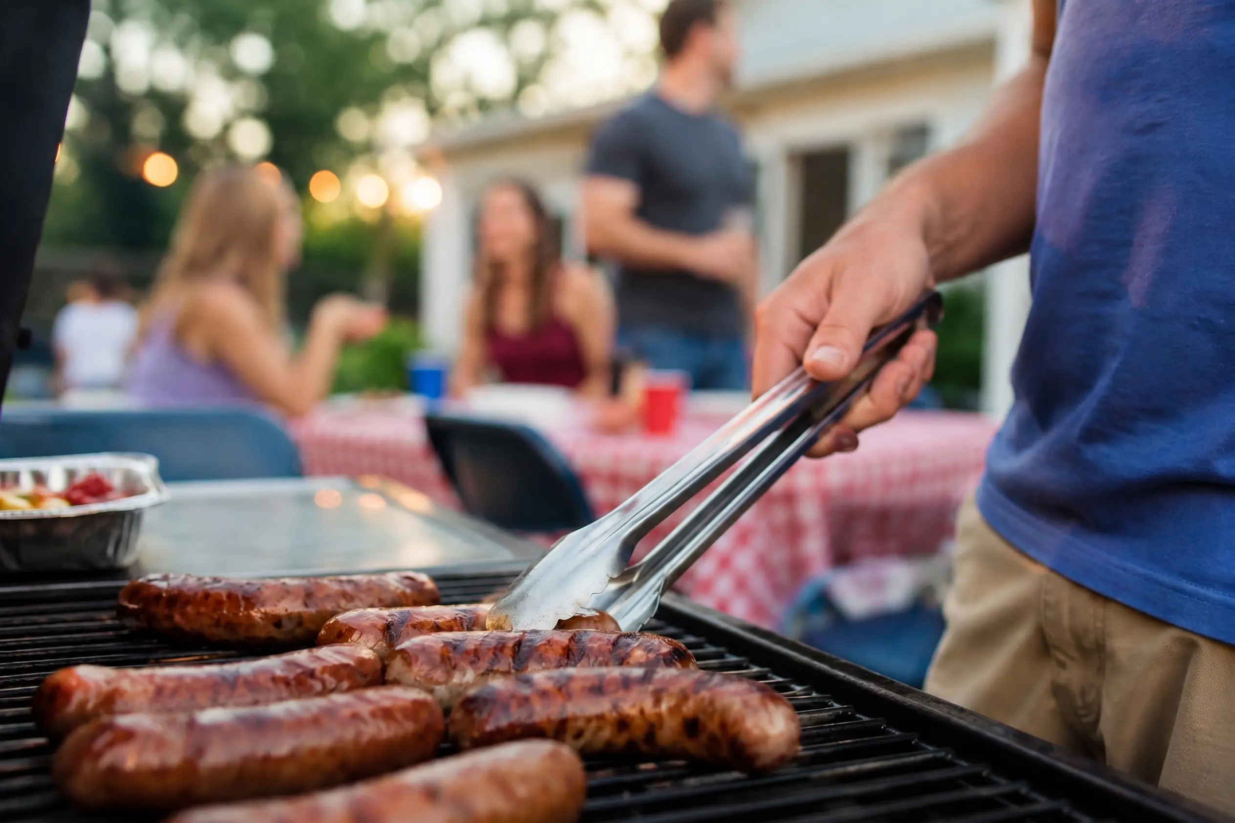 Ricci's sausage links on a grill, summer evening cookout